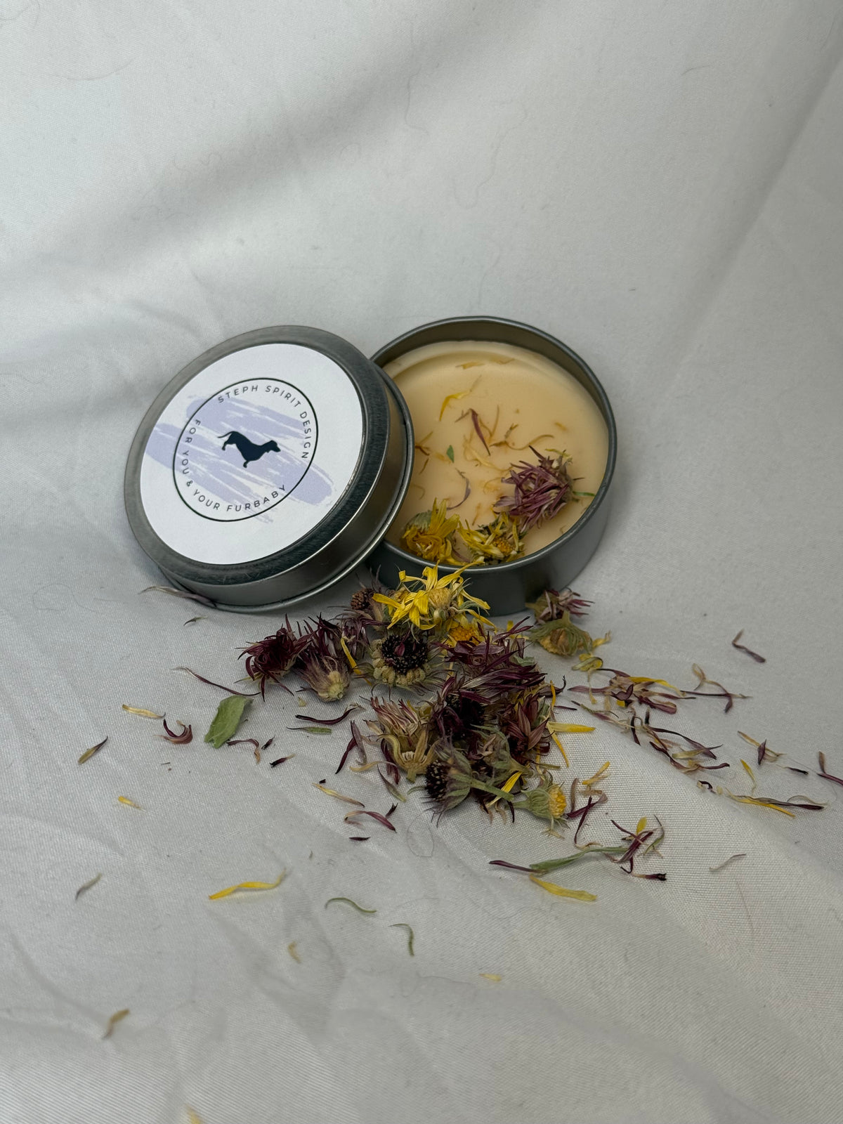 Healing Paw Wax tin open showing natural wax with calendula flowers